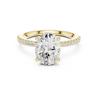 Yellow gold oval cut solitaire ring with thin pave band and lab-grown diamond, elegant style