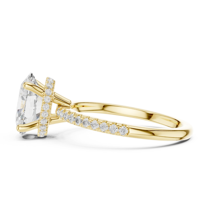 Side view of yellow gold oval cut solitaire ring highlighting thin pave band and gemstone setting