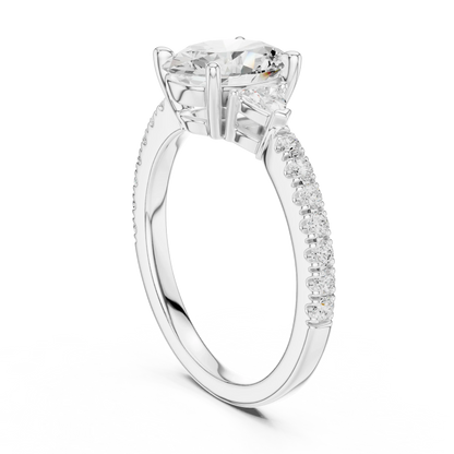 Back view of white gold oval three stone diamond ring with half moon side stones and pave band, showing band and setting