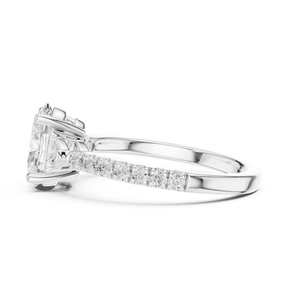 Side view of white gold oval three stone diamond ring with half moon side stones and pave band, highlighting setting profile.