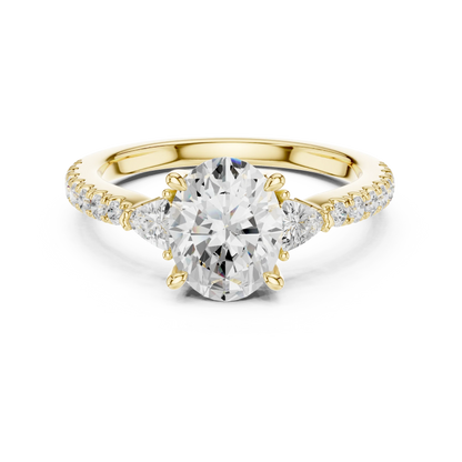 Lab-grown oval cut three stone diamond ring with half moon side stones and pave band in yellow gold, top view.
