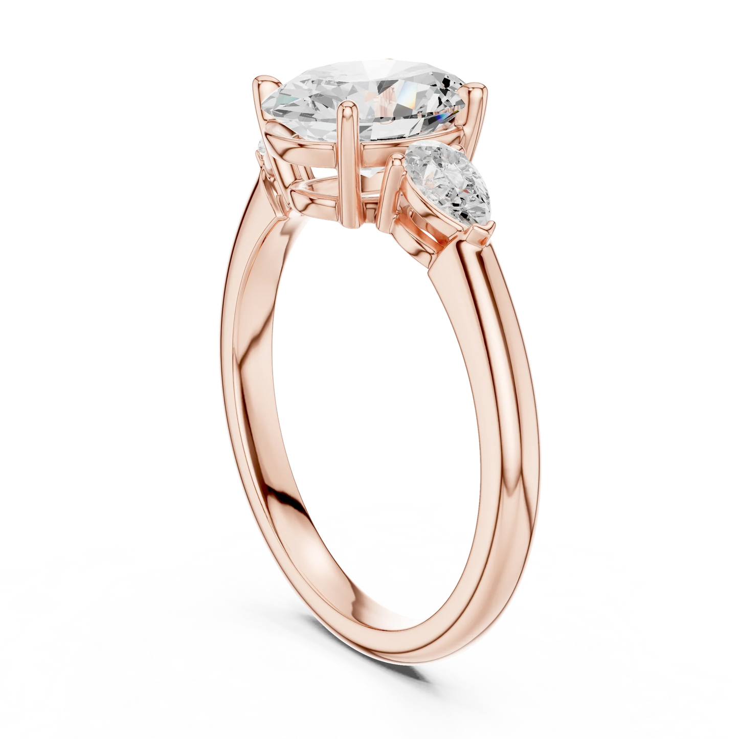 Back side view of rose gold oval three-stone ring with pear side stones and lab-grown diamond 鈥?Australia