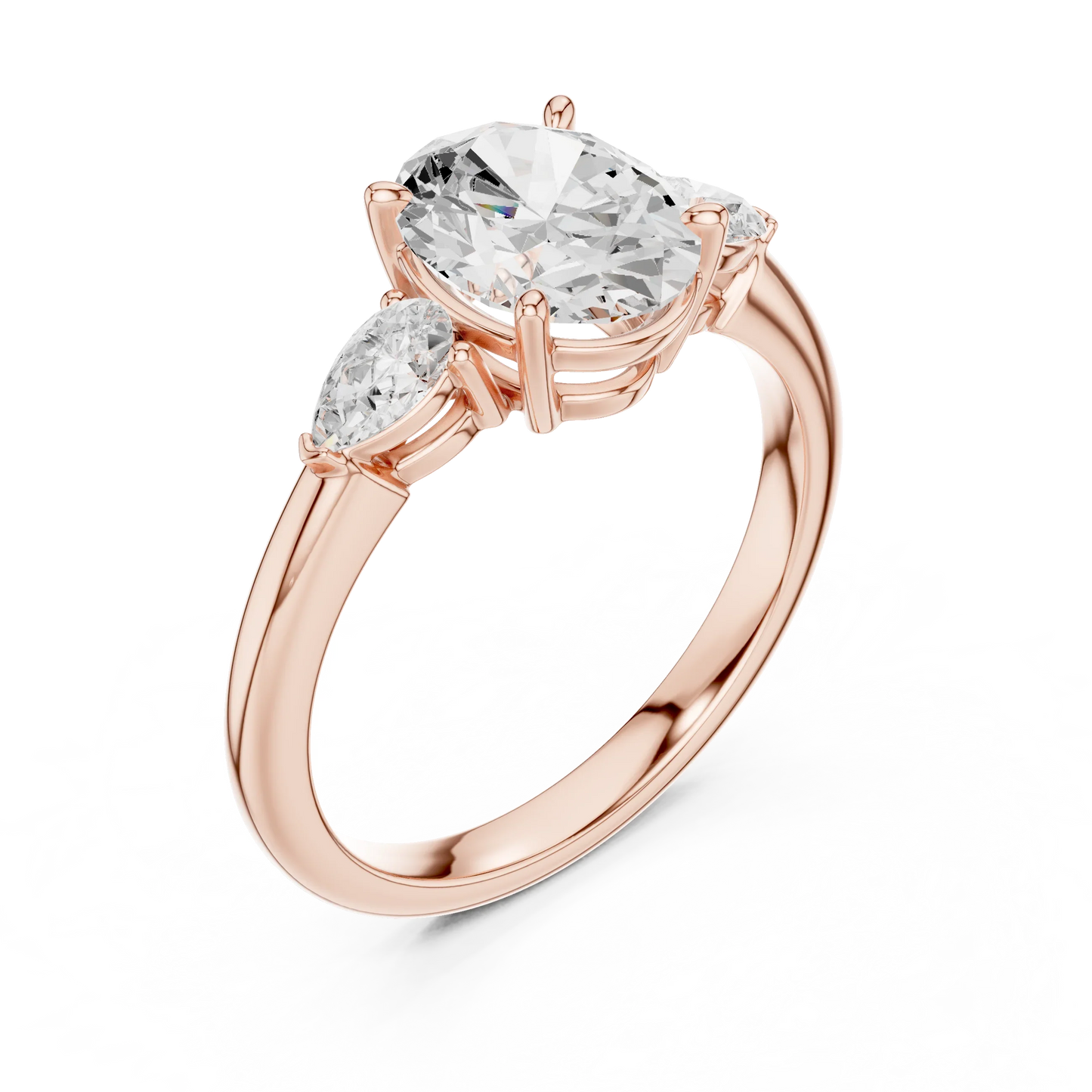 Front view of rose gold oval three-stone ring with pear side stones and lab-grown diamond 鈥?Australia