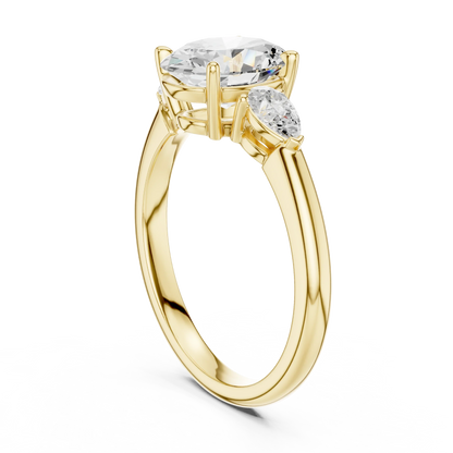 Back side view of yellow gold oval three-stone ring with pear side stones and lab-grown diamond 鈥?Australia
