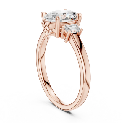 Back side view of rose gold oval three stone diamond ring, detailing band and setting.
