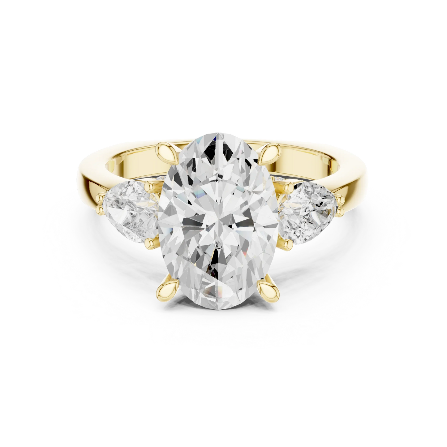 Oval three stone ring with pear side stones and lab-grown diamonds in yellow gold with classic luxury appeal