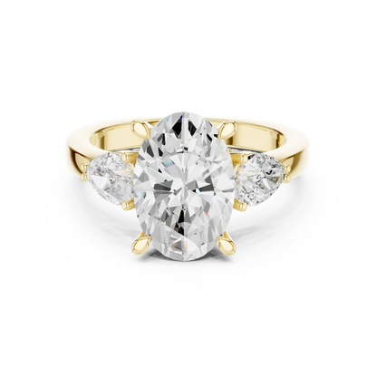 Oval three stone ring with pear side stones and lab-grown diamonds in yellow gold with classic luxury appeal