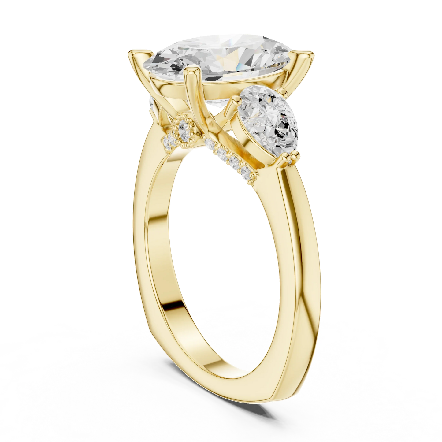 Back view of yellow gold oval three stone ring featuring pear side stones and smooth band