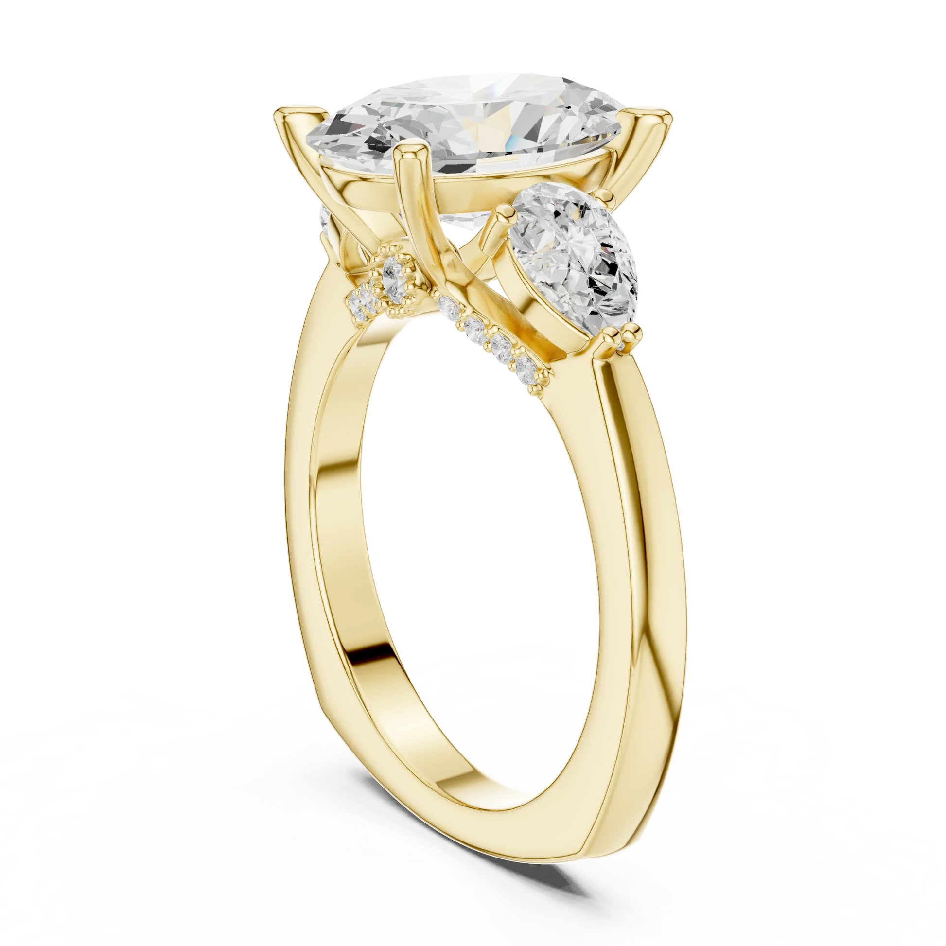 Back view of yellow gold oval three stone ring featuring pear side stones and smooth band