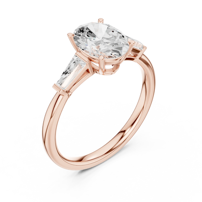 Front view of rose gold oval three stone ring with tapered baguette side stones and lab-grown diamonds