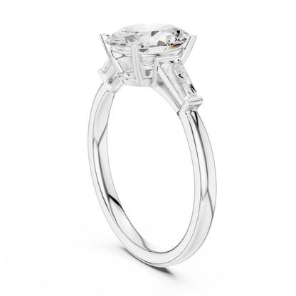 Back view of white gold oval three stone ring featuring tapered baguette side stones and polished band