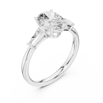 Front view of white gold oval three stone ring with tapered baguette side stones and lab-grown diamonds