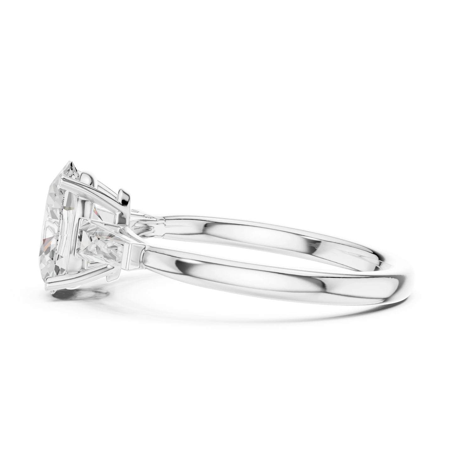 Side view of white gold oval three stone ring highlighting tapered baguette side stones and diamond setting