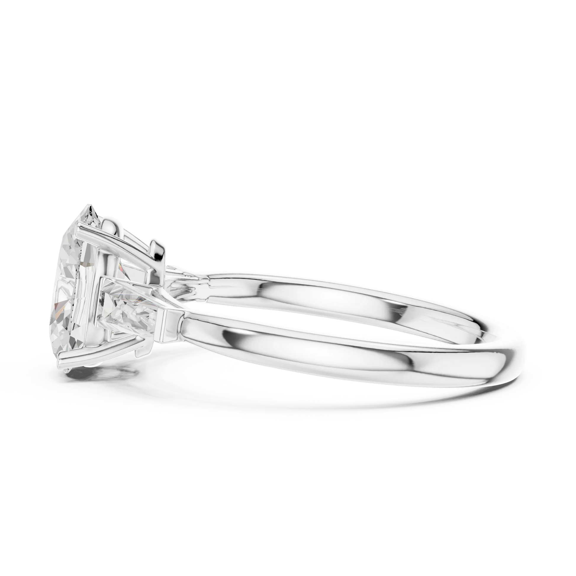 Side view of white gold oval three stone ring highlighting tapered baguette side stones and diamond setting
