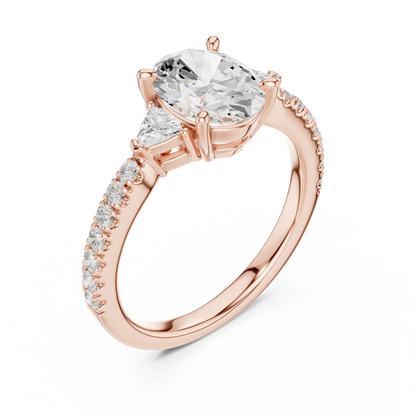 Front view of rose gold oval three stone diamond ring with half moon side stones and pave band, showcasing gemstone brilliance.