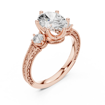 Front view of rose gold oval three stone vintage ring with round brilliant side stones and filigree detailing