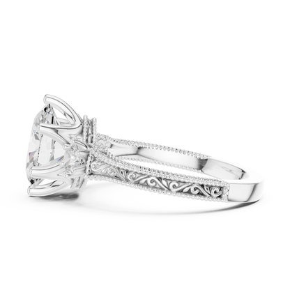 Side view of white gold oval three stone vintage ring highlighting filigree milgrain band and diamond setting