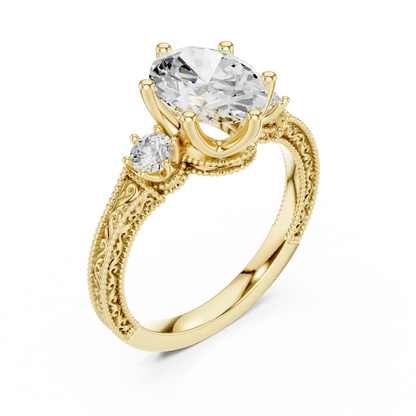 Front view of yellow gold oval three stone vintage ring with round brilliant side stones and milgrain detailing
