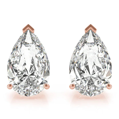 Pair of pear-shaped diamond earrings with rose gold prongs on a white background