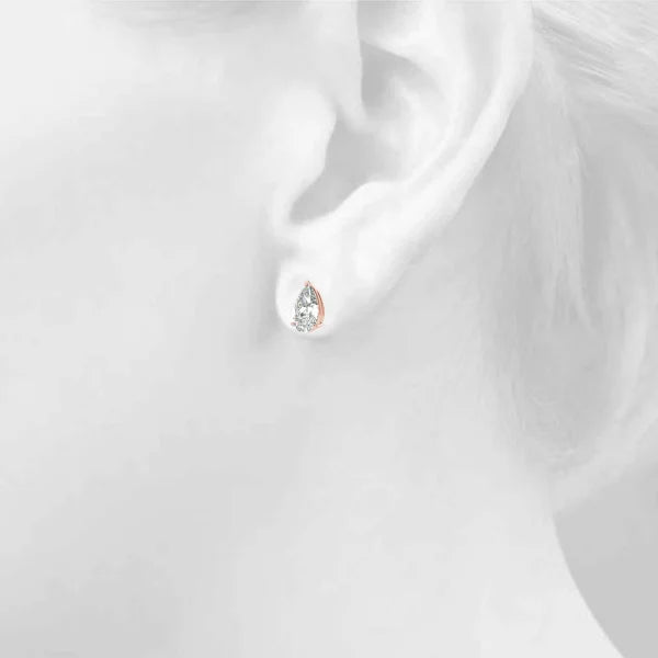 Pear cut diamond stud earring on a girl's ear