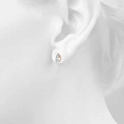 Pear cut diamond stud earring on a girl's ear