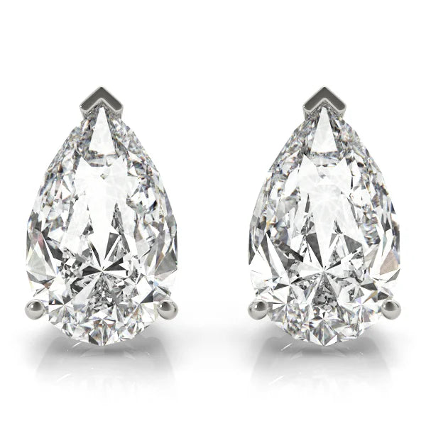 Pair of pear-shaped diamond earrings on a white background