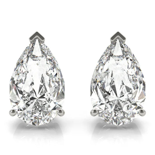 Pair of pear-shaped diamond earrings on a white background