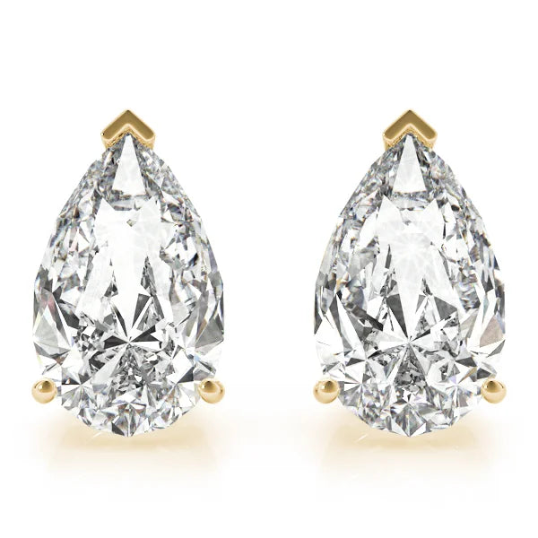 Pair of pear-shaped diamond earrings with gold prongs on a white background