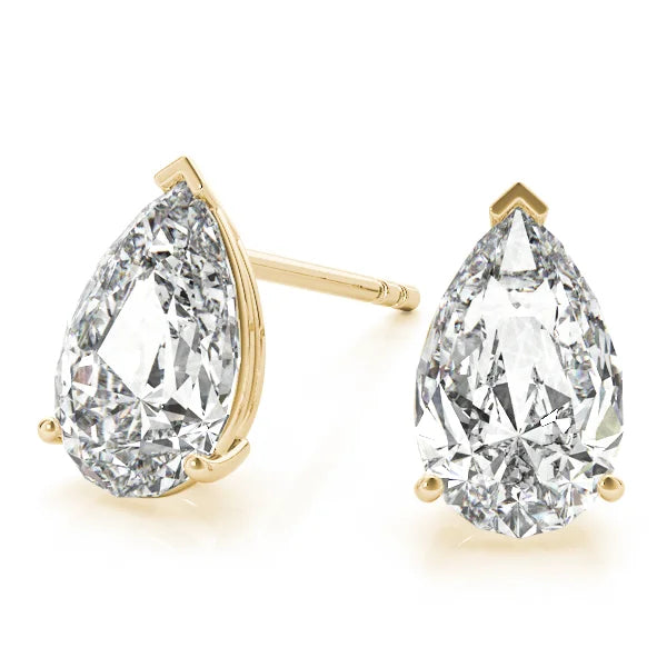 Pair of pear-shaped diamond earrings with gold prongs on a white background with front view