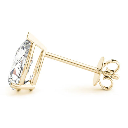 Gold earring with a clear gemstone on a white background