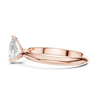 Side view of rose gold pear cut diamond solitaire ring, highlighting design profile