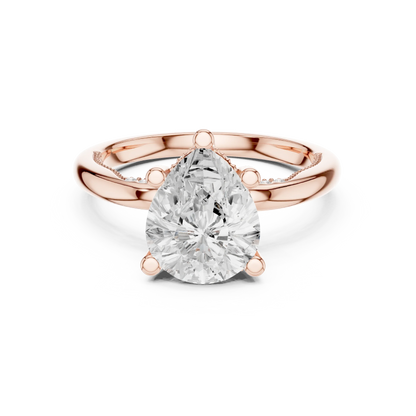 Rose gold pear cut solitaire ring with hidden halo and domed band featuring lab-grown diamond, modern look