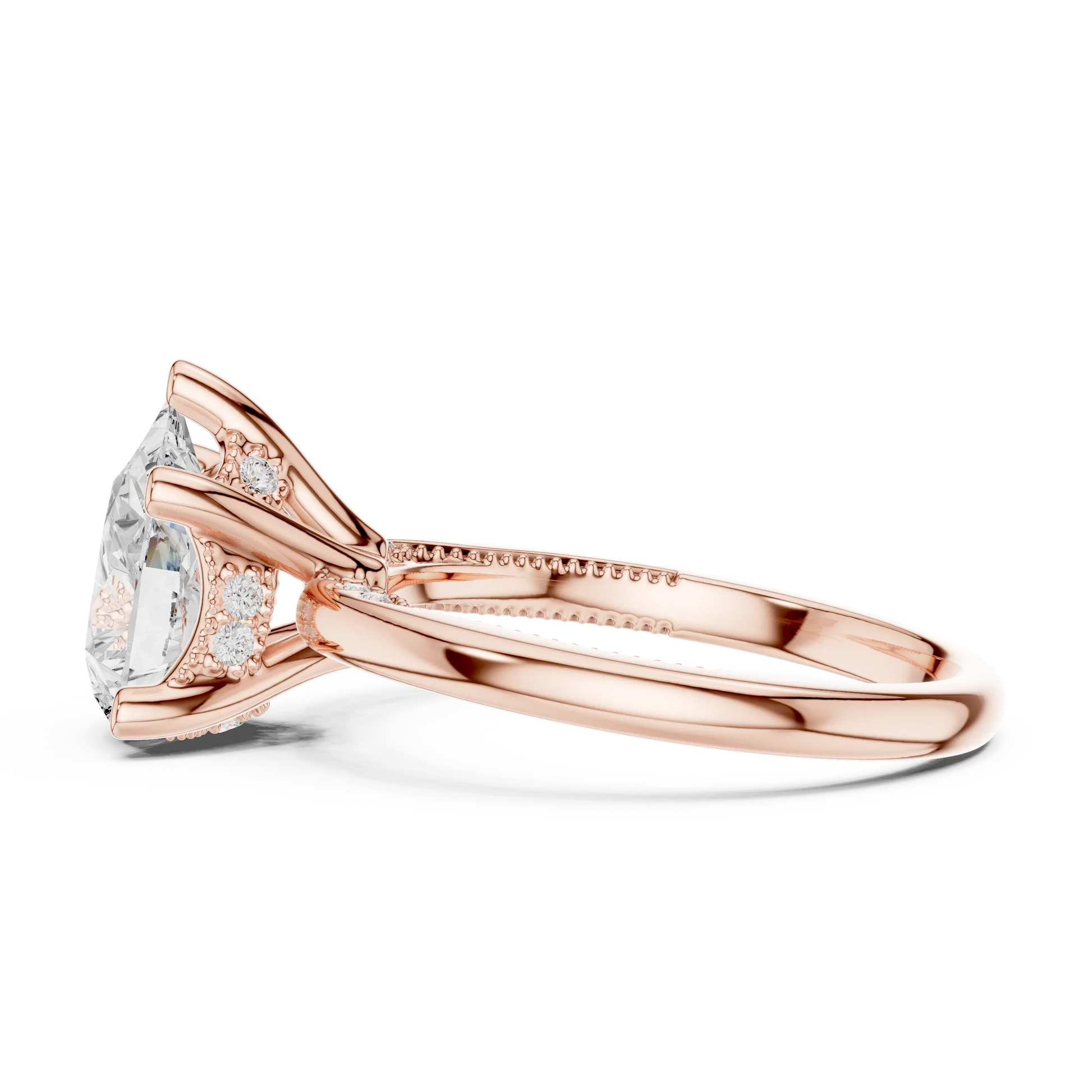 Side view of rose gold pear cut solitaire ring highlighting hidden halo and domed band design