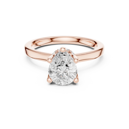 Rose gold pear cut solitaire ring with hidden halo and domed band featuring lab-grown diamond, modern look