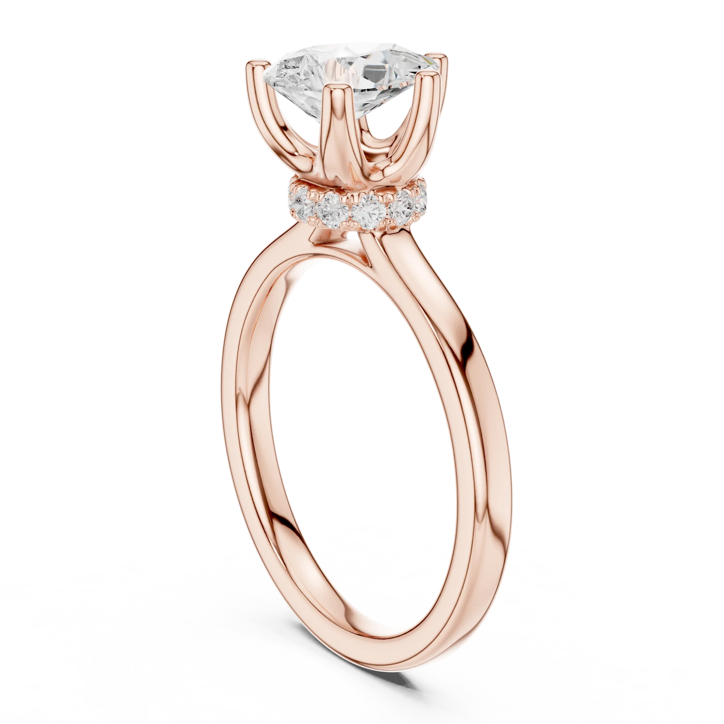 Back side view of rose gold pear cut solitaire ring showing hidden halo and domed band structure