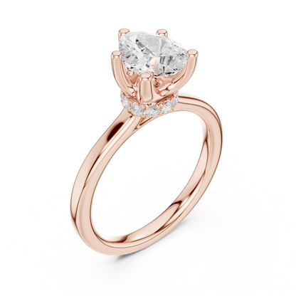 Front view of rose gold pear cut solitaire ring with hidden halo and domed band and lab-created diamond