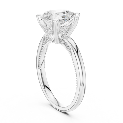 Back side view of white gold pear cut solitaire ring showing hidden halo and domed band details