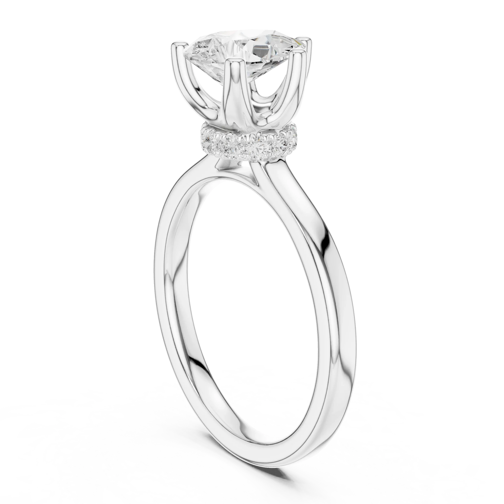 Back side view of white gold pear cut solitaire ring showing hidden halo and domed band details