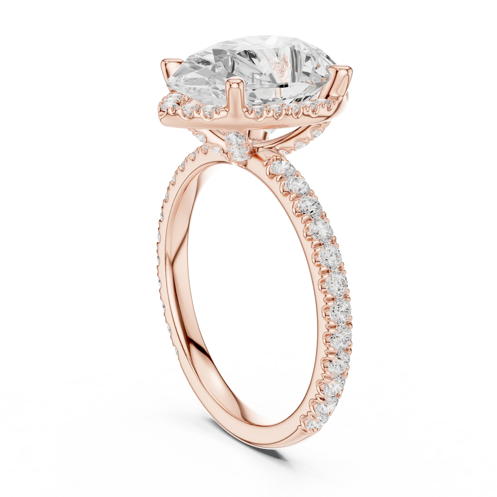Back side view of rose gold pear cut solitaire ring showing hidden halo and thin pav茅 band structure
