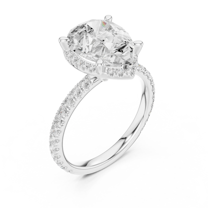 Front view of white gold pear cut solitaire ring with hidden halo and thin pav茅 diamond band and lab-created diamond