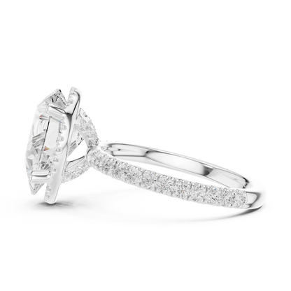Side view of white gold pear cut solitaire ring highlighting hidden halo and thin pav茅 band design