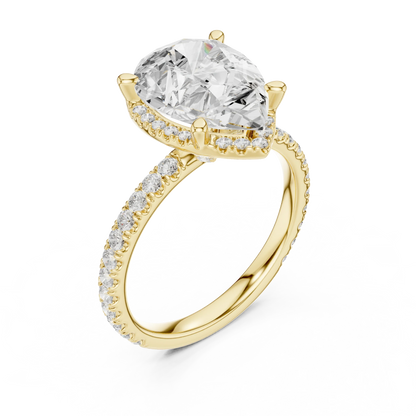 Front view of yellow gold pear cut solitaire ring with hidden halo and thin pav茅 diamond band and lab-created diamond