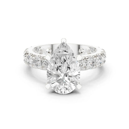 White gold pear cut solitaire ring with pave band and lab-grown diamond, elegant design