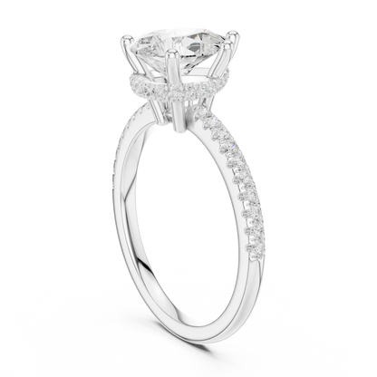 Back side view of white gold pear cut solitaire ring showing thin pave band and setting details