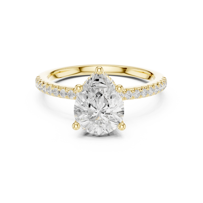 Yellow gold pear cut solitaire ring with thin pave band and lab-grown diamond, elegant style