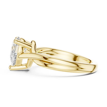 Side view of yellow gold pear cut solitaire ring with twisted band and prong setting
