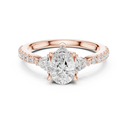 Lab-grown pear cut three stone diamond ring with half moon side stones and pave band in rose gold, top view.