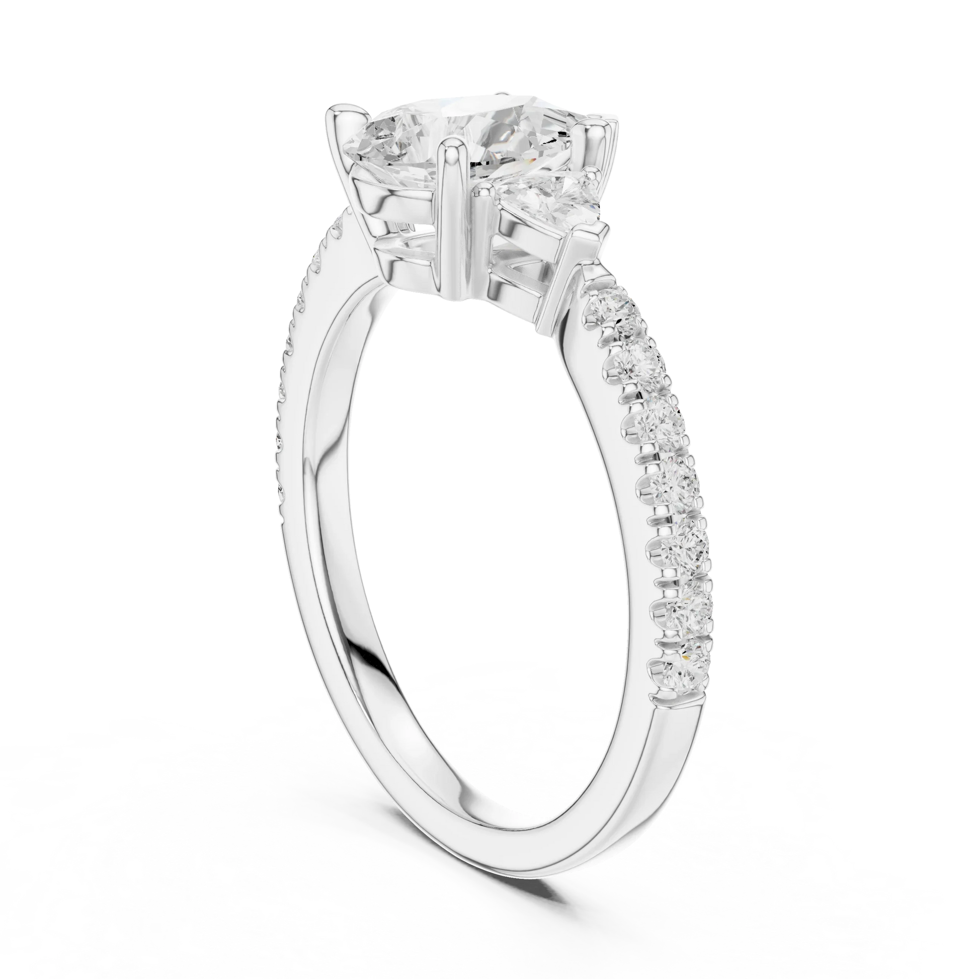 Back view of white gold pear three stone diamond ring with half moon side stones and pave band, showing band and setting.