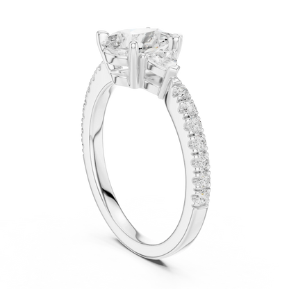 Back view of white gold pear three stone diamond ring with half moon side stones and pave band, showing band and setting.