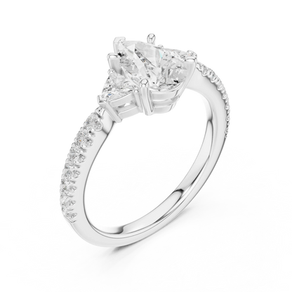 Front view of white gold pear three stone diamond ring with half moon side stones and pave band, showcasing center stone.